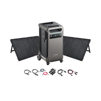 Anker portable power station with digital display, two foldable solar panels behind it, plus multiple charging cables and connectors in front—an ideal off-grid energy solution, all displayed on a white background.