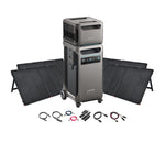 The Anker SOLIX F3800 portable power station with digital display is stacked on another unit, accompanied by four foldable solar panels and cables, demonstrating an Anker solar power system on a white background.