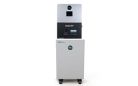 A white and black box-shaped electronic device from BigBattery, featuring control panels and mounted on wheels, stands against a plain white background. Its sleek design, with smooth border radii reminiscent of modern UI themes, adds a subtle touch of sophistication to its overall appearance.