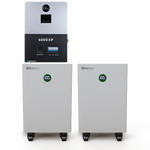 Two white rectangular BigBattery units on wheels, featuring a subtle border radius, sit below a wall-mounted gray and black inverter labeled “6000XP.” Green digital displays—set in an IBM Plex Sans font family—show “100” on both battery units.