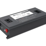 Rectangular gray BigBattery with two black handles, a label on top displaying clear IBM Plex Sans font, and red and black terminals on the side. The battery’s edges feature a subtle border radius, set against a plain white background.