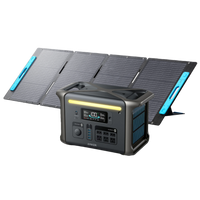 An Anker portable power generator with HyperFlash technology and a digital display is set in front of a four-panel foldable solar array, both built for outdoor or emergency use.