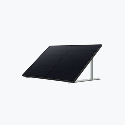 An Anker black solar panel is mounted on a metal frame, angled upward for optimal sunlight, set against a plain light gray background.