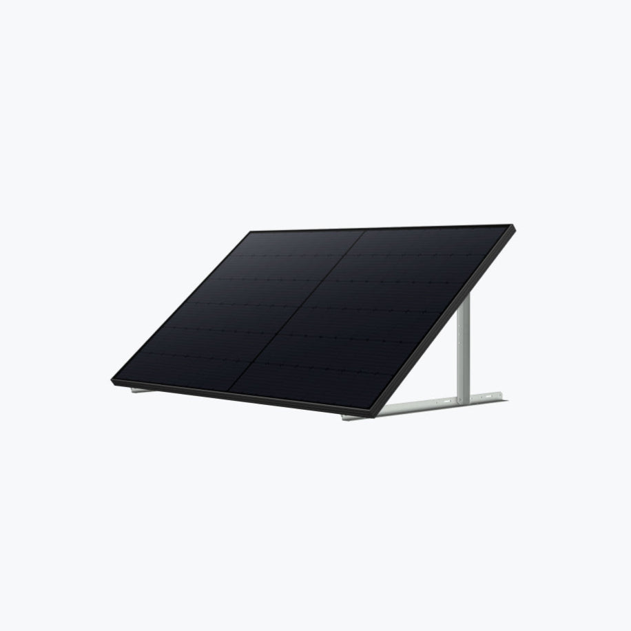 An Anker black solar panel is mounted on a metal frame, angled upward for optimal sunlight, set against a plain light gray background.