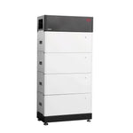The tall, rectangular BYD modular storage unit features four stacked sections, a dark top panel, black-and-white finish, small adjustable feet, and uses lithium iron phosphate cells.