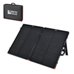 The Rich Solar portable black folding solar panel with red accents is open, revealing two sections. A carrying case marked Rich Solar sits in the top left. Its design makes it ideal for easy outdoor transport and off-grid solar adventures.