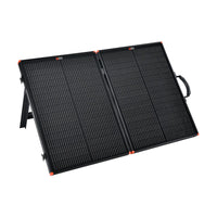 The Rich Solar portable solar charging kit features a foldable black panel with orange corners, stand, and carrying handle—ideal for off-grid trailer setups—all shown against a white background.