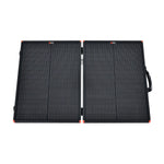 The Rich Solar foldable black portable charging kit features two rectangular solar panels connected by a hinge, a right-edge handle, and red corner accents—perfect for powering an off-grid solar trailer.
