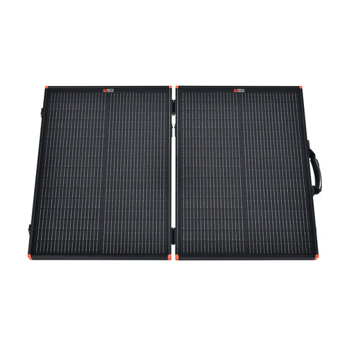 The Rich Solar foldable black portable charging kit features two rectangular solar panels connected by a hinge, a right-edge handle, and red corner accents—perfect for powering an off-grid solar trailer.