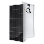A black and silver rectangular Zendure solar panel stands upright, showing solar cells on the front and a junction box with attached cables on the back.
