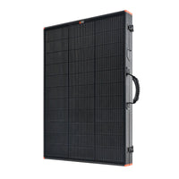 The Rich Solar portable black monocrystalline solar panel features a grid pattern, sturdy frame, side carrying handle, and orange corner accents. Shown upright at an angle, its ideal for RV solar installation.