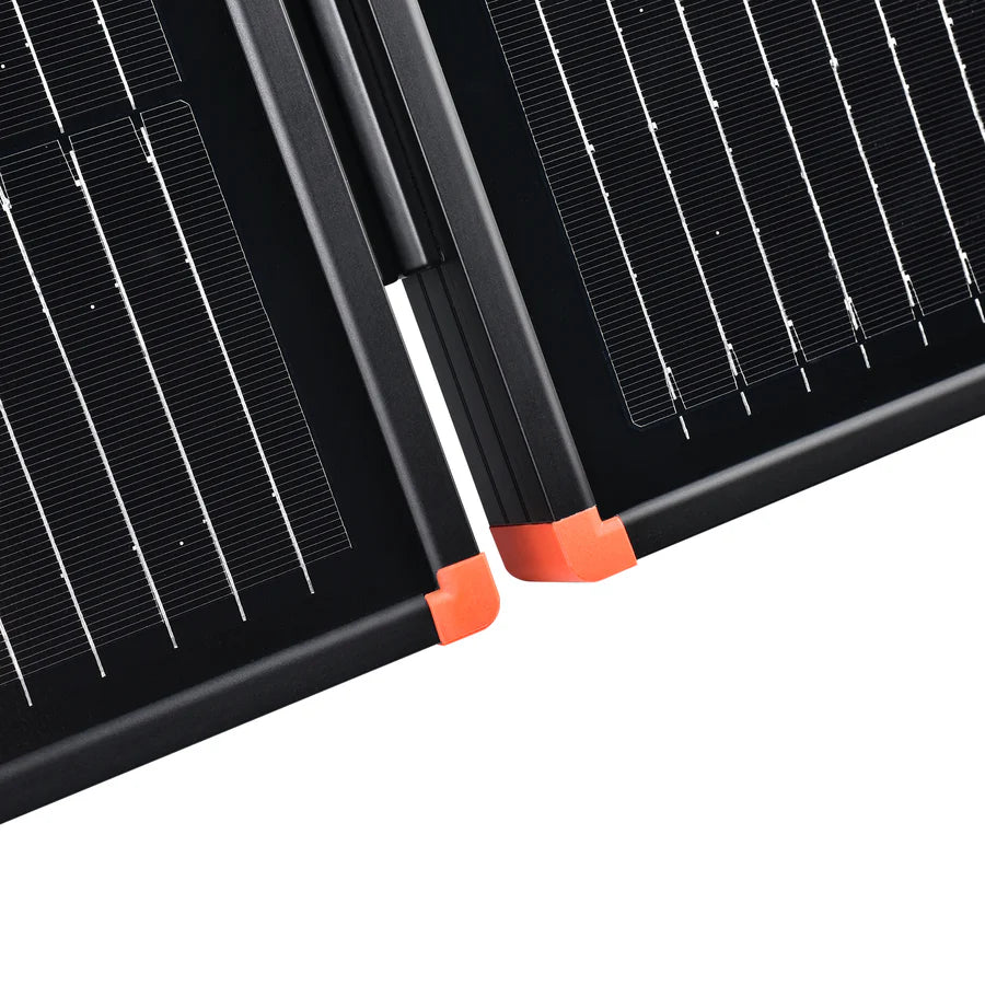 Close-up view of a 200W Rich Solar briefcase kit featuring two black panels with bright orange corners. Its sleek design and visible grid lines make it perfect for portable solar power or RV installation.