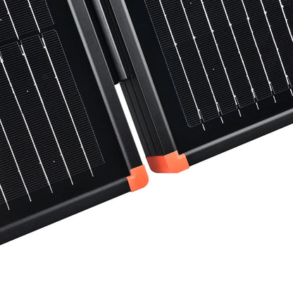 Close-up view of a 200W Rich Solar briefcase kit featuring two black panels with bright orange corners. Its sleek design and visible grid lines make it perfect for portable solar power or RV installation.