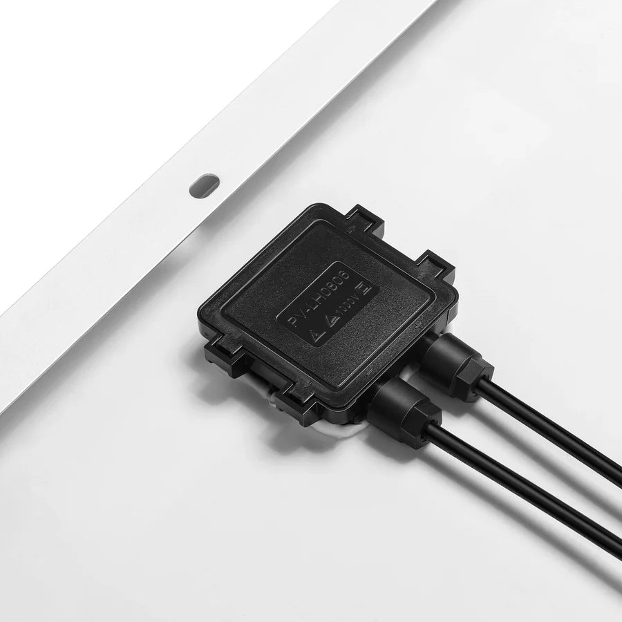 Close-up of the back of a Rich Solar 12V off-grid solar panel, featuring a black junction box with two connected cables and a sturdy aluminum frame, displayed on a white background.