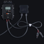 Rich Solar charge controller and connector box with attached cables and MC4 connectors, shown on a dark background—perfect for off-grid solar trailers or portable charging kits. Features labeled buttons, organized wires, and a white cable tie.
