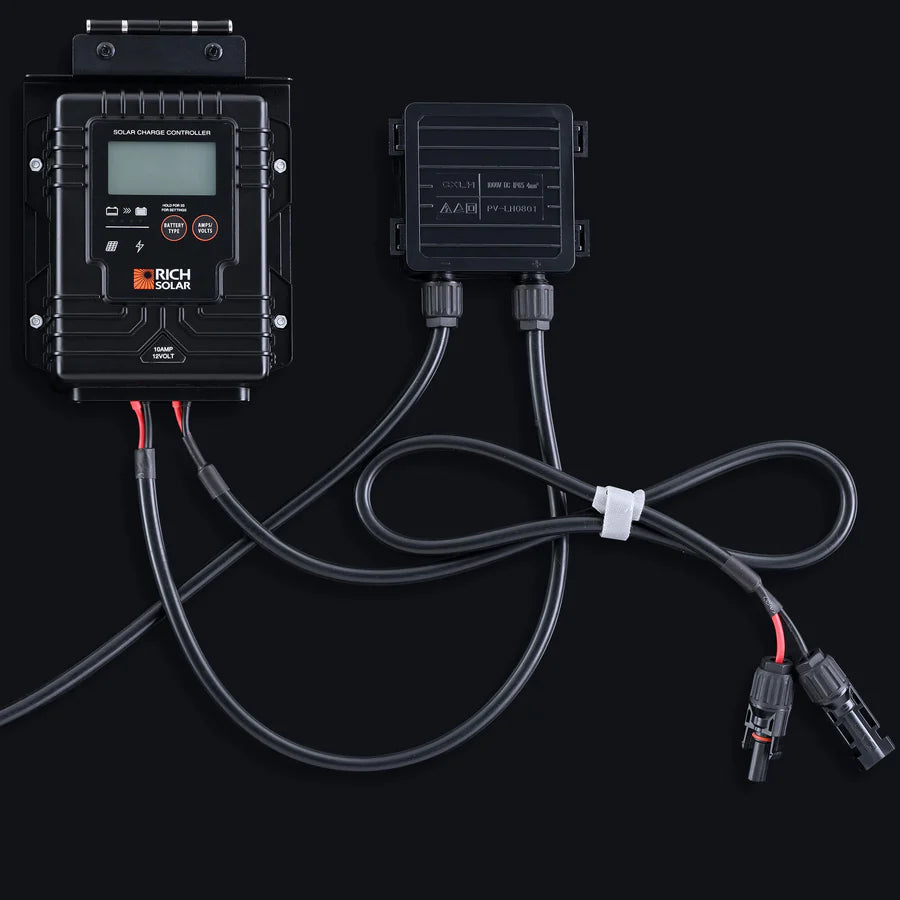 Rich Solar charge controller and connector box with attached cables and MC4 connectors, shown on a dark background—perfect for off-grid solar trailers or portable charging kits. Features labeled buttons, organized wires, and a white cable tie.