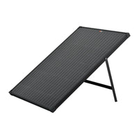 The Rich Solar 100 Watt Portable Solar Panel, shown angled on a metal stand against a white background, is ideal for off-grid adventures or enhancing your camper’s solar setup.