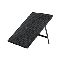 A Rich Solar black 60 Watt portable solar panel, made of monocrystalline silicon, is propped at an angle on a foldable stand against a plain white background.