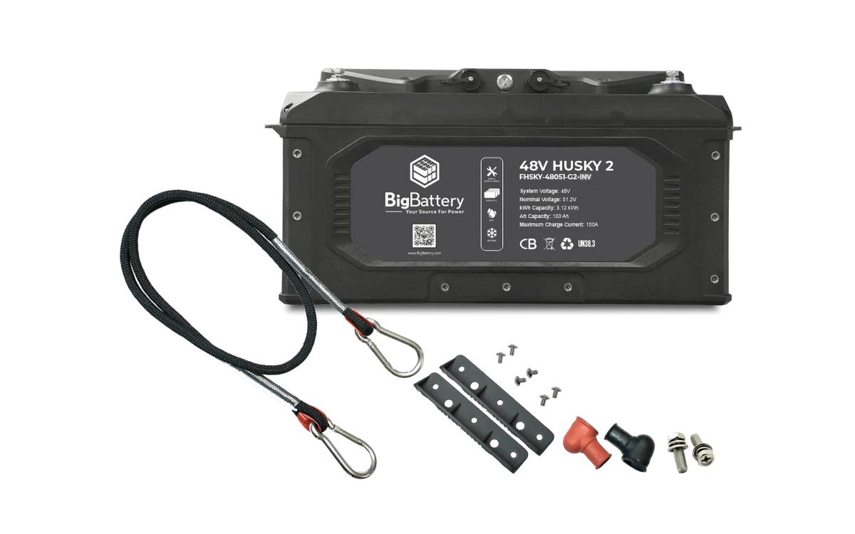 A black 48V BigBattery Husky 2 battery, featuring the BigBattery logo, is displayed on a white background with a subtle box shadow for depth. The product is accompanied by two steel cables, mounting hardware, and electrical connectors.