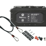 A black 48V BigBattery 2 battery with cables, two metal brackets, screws, and connectors is neatly arranged on a white card background, ideal for showcasing clear details in any font display such as IBM Plex Sans.