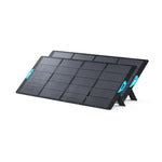 Two Anker SOLIX PS400 Solar Panels with blue handles stand upright on kickstands, side by side and angled left. Each panel delivers 400W solar power and features IP67 waterproof protection for reliable outdoor use.