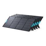Four black Anker SOLIX PS400 Solar Panels with blue accents, each delivering 400W solar power and IP67 waterproof protection, stand upright on sturdy kickstands in a row against a plain white background.
