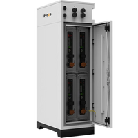 A white Pytes outdoor battery cabinet, V-BOX-OC, stands with its door open to display four vertically stacked LiFePO₄ batteries, with control knobs and indicators on the top front panel.