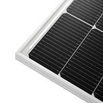 Close-up of the corner of a rectangular black solar panel with a white frame, showing the grid pattern and texture of the photovoltaic cells, accentuated by a subtle box-shadow effect along the crisp border-radius.