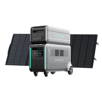 The Zendure SuperBase V, a portable power station with expandable capacity and a stacked battery unit on wheels, is set before two large solar panels—an efficient, modern home energy storage solution.
