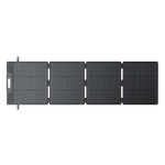 A foldable, four-panel Bluetti solar charger is fully unfolded and laid flat, displaying its grid-like monocrystalline cells and fast-charging connectors on one end.