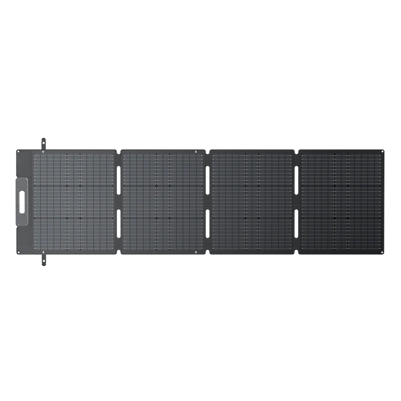 A foldable, four-panel Bluetti solar charger is fully unfolded and laid flat, displaying its grid-like monocrystalline cells and fast-charging connectors on one end.