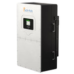 The Sol-Ark power inverter is white and black with a digital display, front panel buttons, AC/DC coupling, side handles, and is mounted vertically.