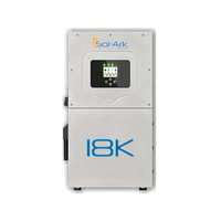 A silver Sol-Ark residential inverter with a digital green-lit display, designed for solar power and battery backup systems, is shown against a plain white background.