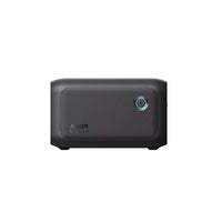 The Anker SOLIX BP1000X is a compact, rectangular black portable power station featuring a textured side panel, circular blue front power button, and expansion battery built for an impressive 10-year lifespan.