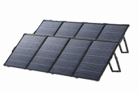 A portable foldable solar panel setup, featuring the Anker SOLIX PS400 400W portable solar panel, includes eight monocrystalline rectangular panels arranged in two rows and supported by angled stands on a white background.
