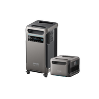 Two silver and black Anker portable power stations stand side by side. The taller unit, featuring wheels and a display screen, is the Solix F3800 with intelligent energy monitoring; both have handles on top.