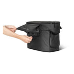 A person lifts the flap of a black rectangular EcoFlow carrying case with side pockets, revealing an EcoFlow device inside, recognized for its advanced BMS protection.