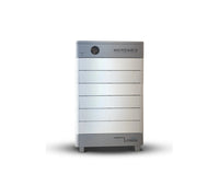 A white and gray rectangular Homegrid modular home battery stands upright, featuring a power button and indicators on top left, branding at top right and bottom front—offering expandable capacity and whole-home backup power.