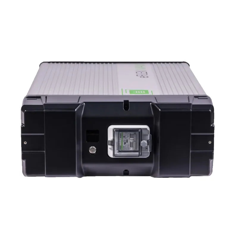 The Fortress Power unit is a rectangular, black and gray energy storage solution with a central digital display, indicator lights on the front, ribbed sides, and a robust industrial design.