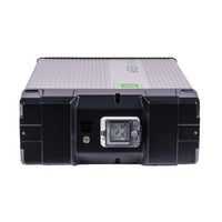 The Fortress Power unit is a rectangular, black and gray energy storage solution with a central digital display, indicator lights on the front, ribbed sides, and a robust industrial design.