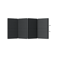 An Ecoflow black, four-panel foldable solar panel is fully extended, displaying its 400W portable capacity and a carrying handle on the right. Its surface features a grid-like pattern, ideal for off-grid living. The background is transparent.