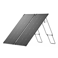 Two black, rectangular Ecoflow solar panels with a modular design are propped on folding stands, positioned side by side at an angle against a plain white background.