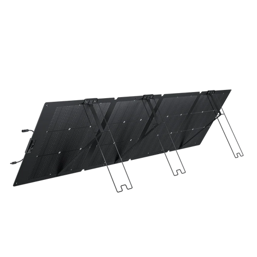 An Ecoflow black portable waterproof solar panel is unfolded and propped up at an angle with built-in stands, displaying its grid of solar cells for outdoor use.