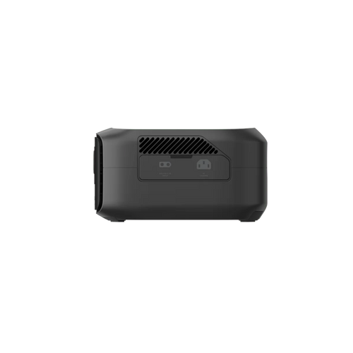 A black rectangular Ecoflow device is shown from the back, featuring ventilation slats and two ports. Its compact, portable design with advanced X-GaNPower technology is set against a plain white background.