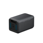 A black, rectangular Anker SOLIX BP1000X Expansion Battery with rounded edges, a USB port, and blue vent lines on one end is displayed against a plain white background.