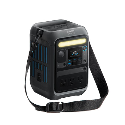 A portable black Anker 288Wh power station with a shoulder strap, LED light bar, display screen, control buttons, and multiple outlets—including three AC sockets—is shown on a white background. It also features smart app control.