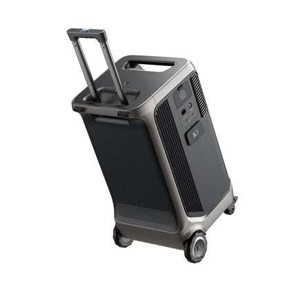 A portable, black and gray Anker Solix F3800 power station with expandable capacity, wheels, telescopic handle, multiple outlets, and side air vents, resembling a compact suitcase.
