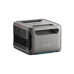 Anker’s compact gray SOLIX portable power station features expandable capacity, a top handle, side vent and control buttons, with the Anker logo on the front, all set against a white background.