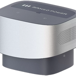 The Mango Power portable battery is a compact, rectangular device with rounded edges and ventilation holes, finished in silver and gray—perfect for home backup power.